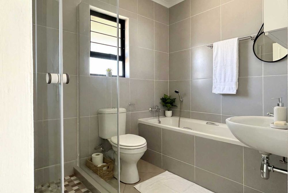 Family bathroom equipped with both shower and bath.