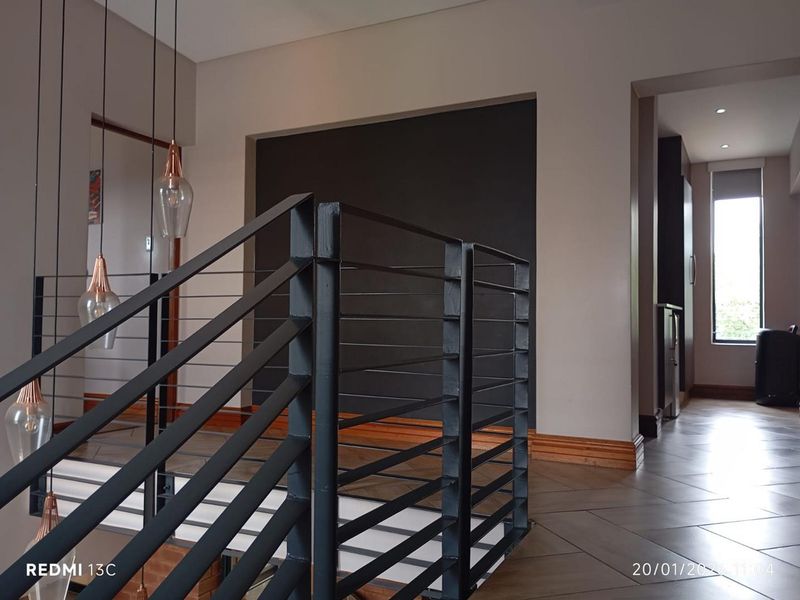 Elegant Family Living in Secure Glen Eagle Estate - Photo 6