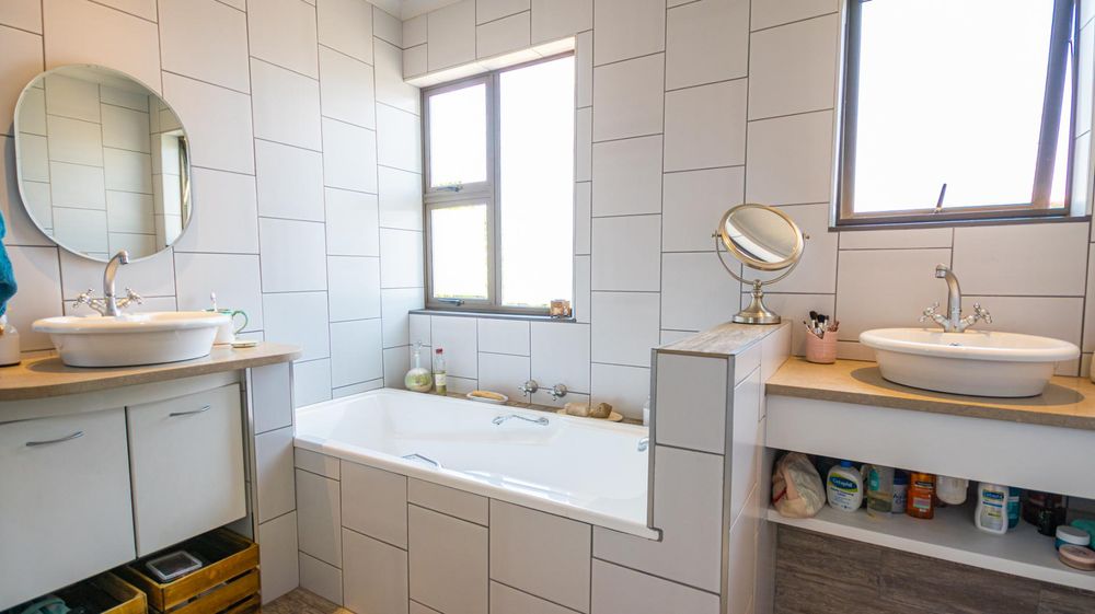 Bathroom with walk in shower, and 2 separately fitted basins to prevent fighting and a separate toilet