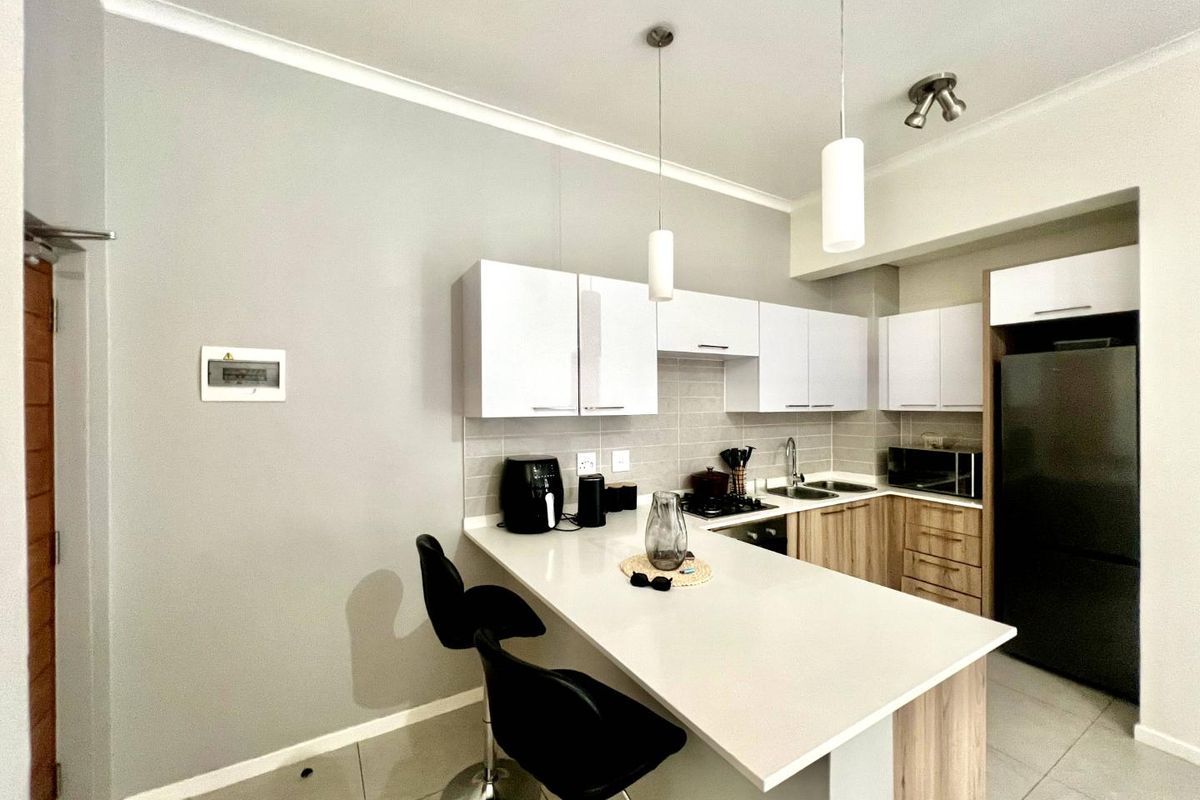 Modern Elegance: 1-Bedroom Gem with Balcony & Braai - Photo 2