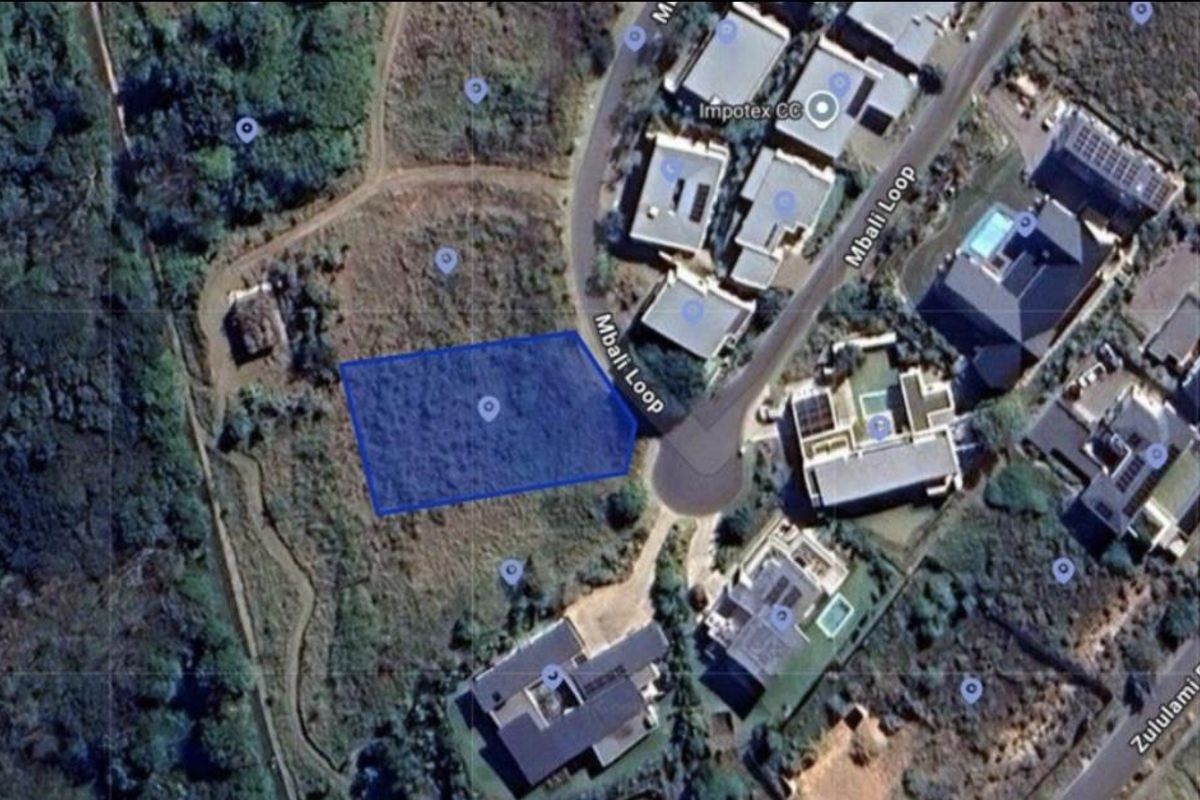 Aerial view of a vacant residential land plot located on Mbali Loop, showing the site boundaries and surrounding neighborhood context.