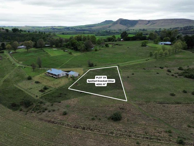 An aerial view of a 4093 square meter vacant residential plot in a rural landscape setting.