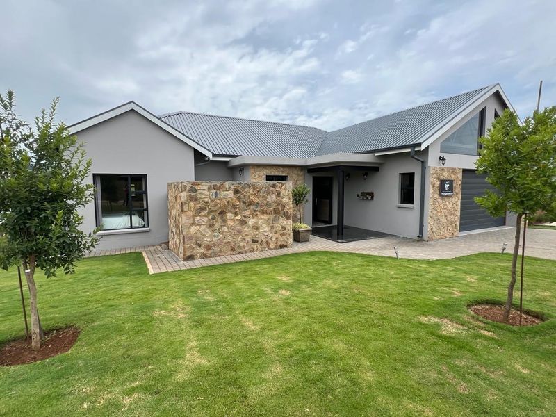 INCOME GENERATING HOME Welcome to this charming 4 bedroom home nestled within Highland Gate Golf Estate - Photo 2