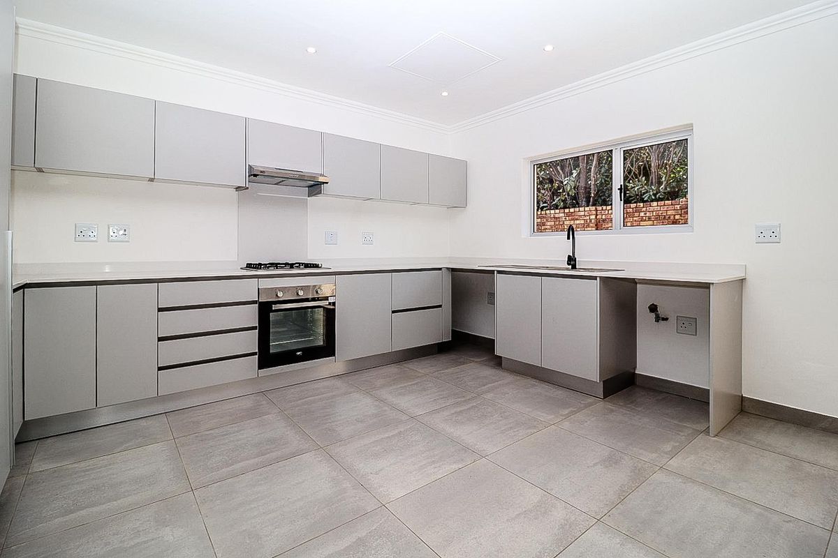 Modern Comfort Meets Secure Garden Living! - Photo 5
