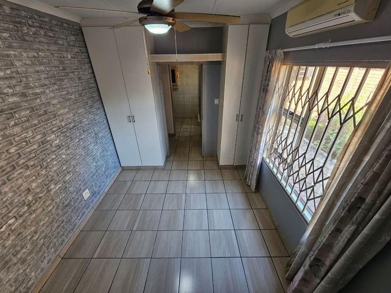 Four-Bedroom Family Home with Pool and Braai in Arboretum - Photo 9