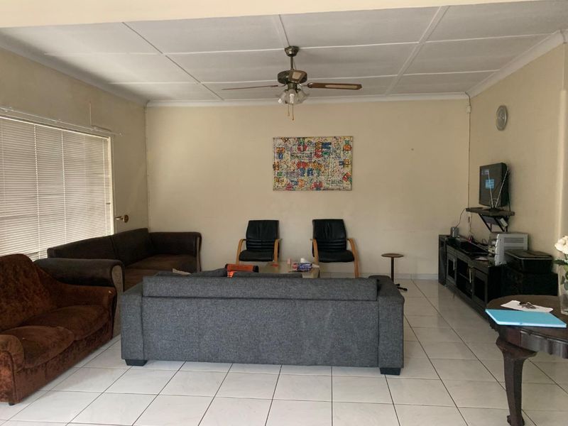 **Charming 3-Bedroom Home with Income Potential in a Tranquil Neighborhood** - Photo 2