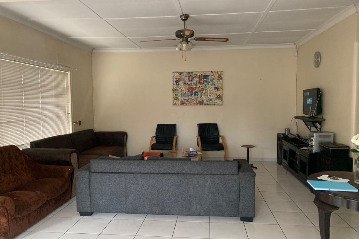 **Charming 3-Bedroom Home with Income Potential in a Tranquil Neighborhood** - Photo 2