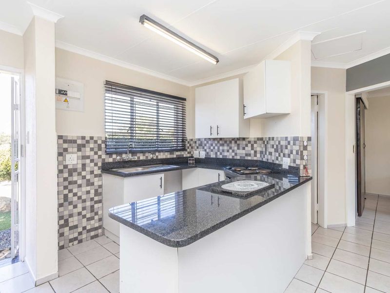 Spacious 1 Bedroom Townhouse with Expansive Private Garden | Sunrock Village Gem - Photo 6
