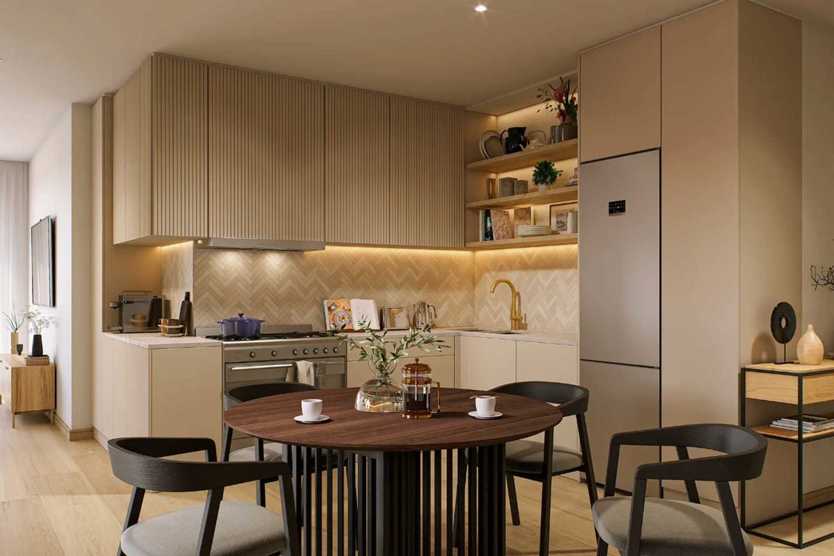 Modern open-plan kitchen featuring fluted cabinetry, herringbone backsplash, integrated appliances, and warm recessed lighting, seamlessly flowing into the living area with balcony access.