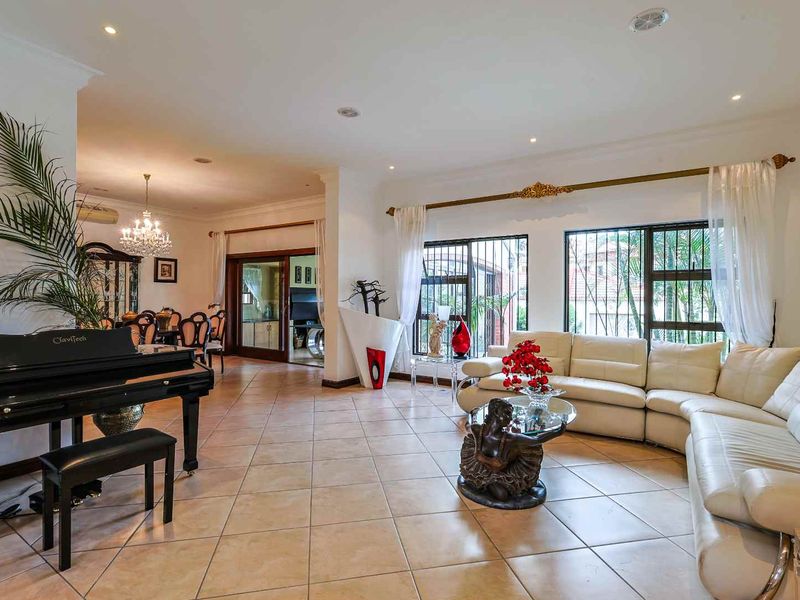 This spacious fully furnished 4-bedroom, 3.5-bathroom home offers comfortable family living with generous entertainment areas and modern conveniences. - Photo 5