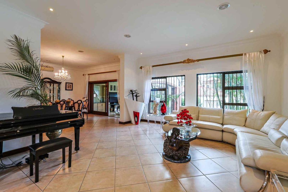 This spacious fully furnished 4-bedroom, 3.5-bathroom home offers comfortable family living with generous entertainment areas and modern conveniences. - Photo 5