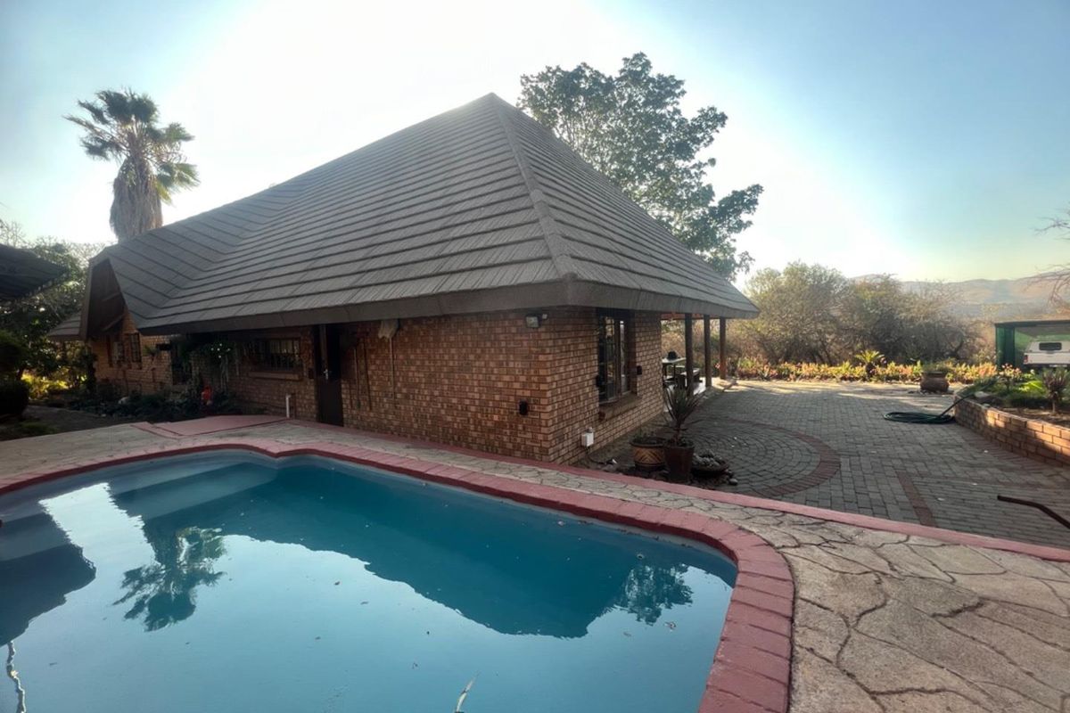 Expansive Property with Main House & Income-Generating Second Property - Photo 2