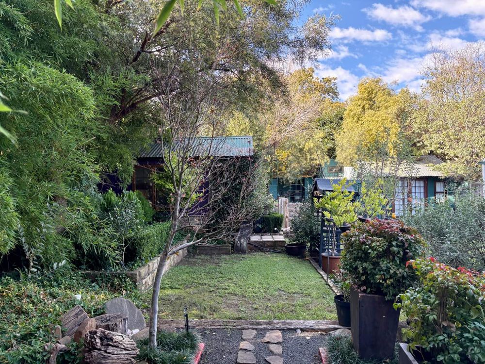 Garden with two Wendy houses.