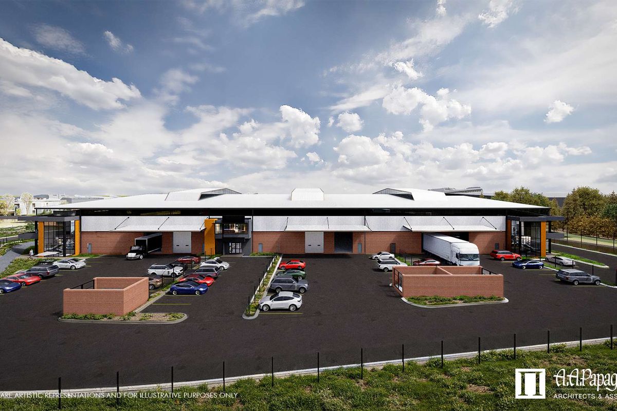 A professional architectural rendering of a modern industrial warehouse facility featuring multiple loading bays, expansive parking areas, and contemporary brick and metal facade design.