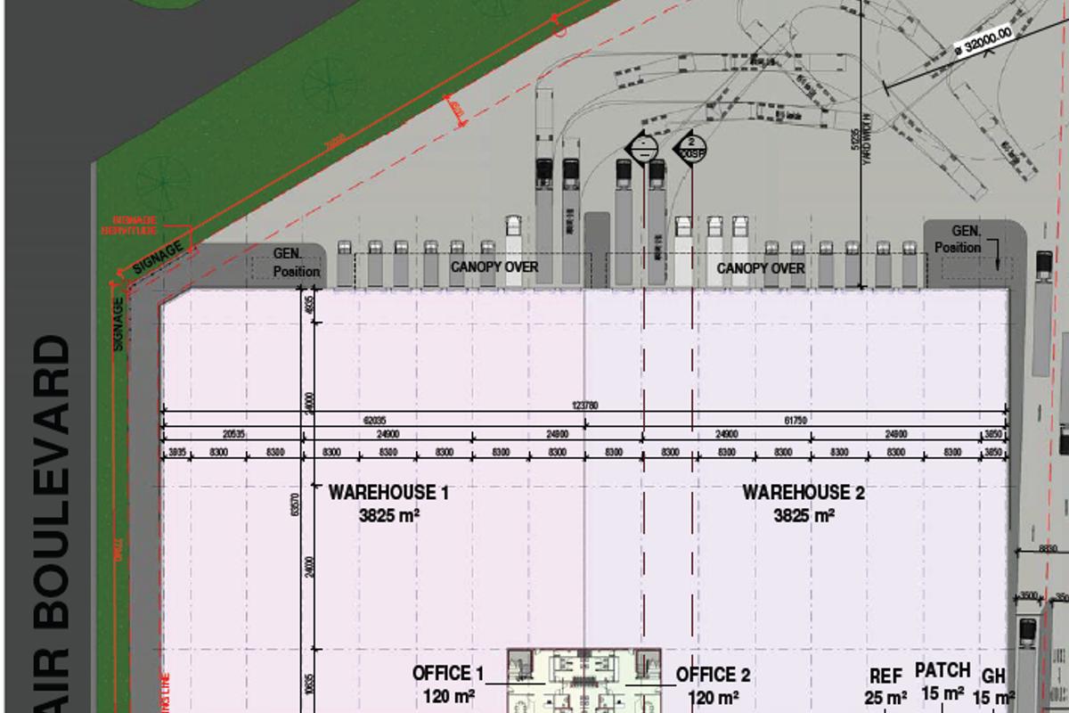 A detailed site plan showing the layout of two large warehouses, office spaces, parking bays, and access points from surrounding roads.