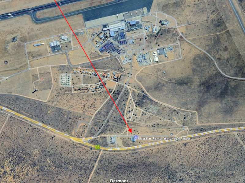 Aerial view showing the industrial property location relative to the airport and main road network.