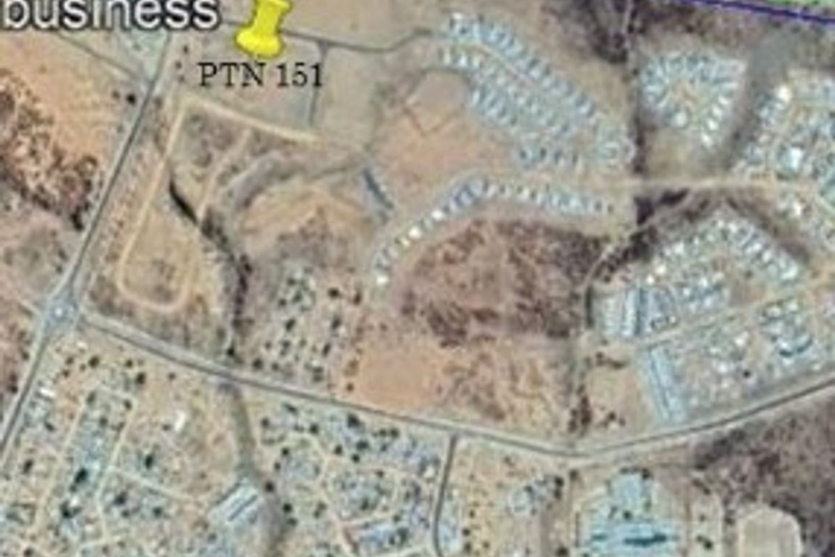 An aerial satellite view showing the layout of the commercial land parcels and surrounding road infrastructure in Okahandja.