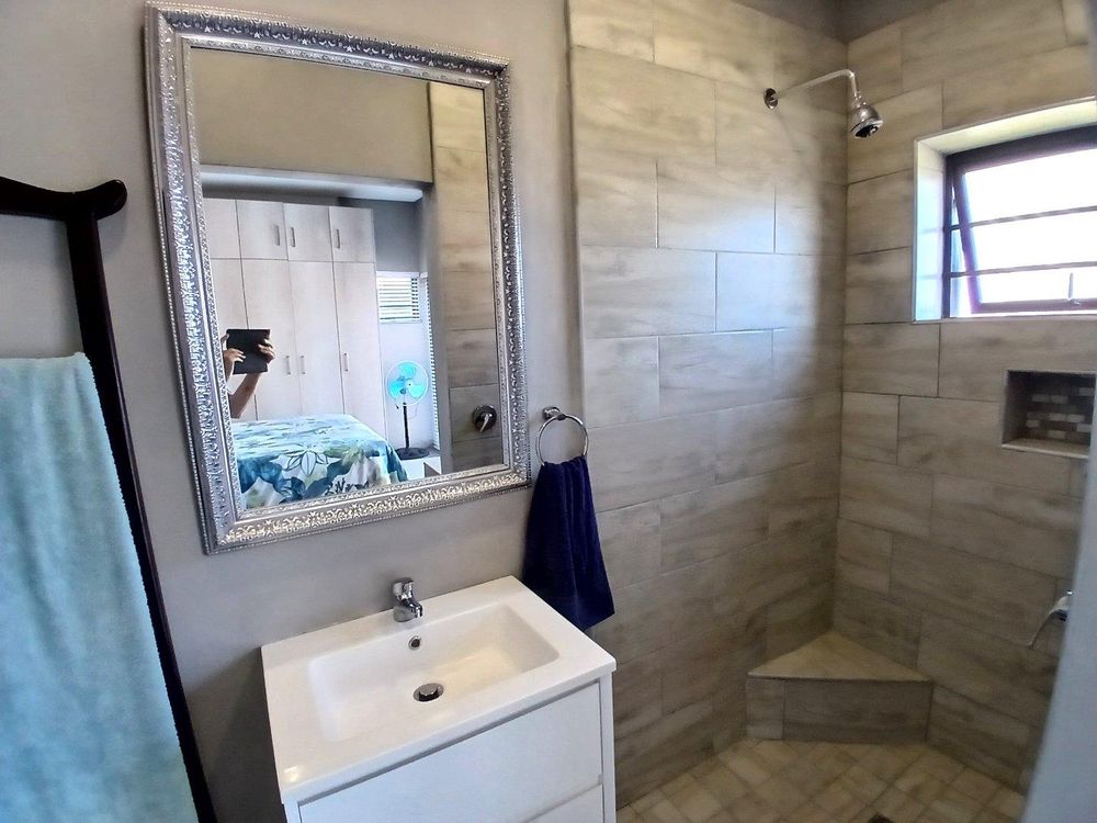 One side of Main Bedroom's en suite Bathroom (with shower).