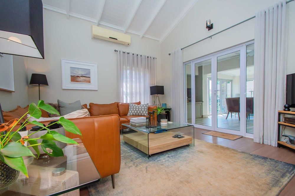 Lounge with entertainment area in background