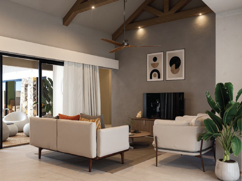 Modern living room featuring exposed timber ceiling beams, polished concrete floors, and large sliding glass doors opening to an outdoor patio area.