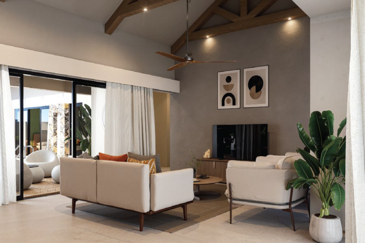 Modern living room featuring exposed timber ceiling beams, polished concrete floors, and large sliding glass doors opening to an outdoor patio area.