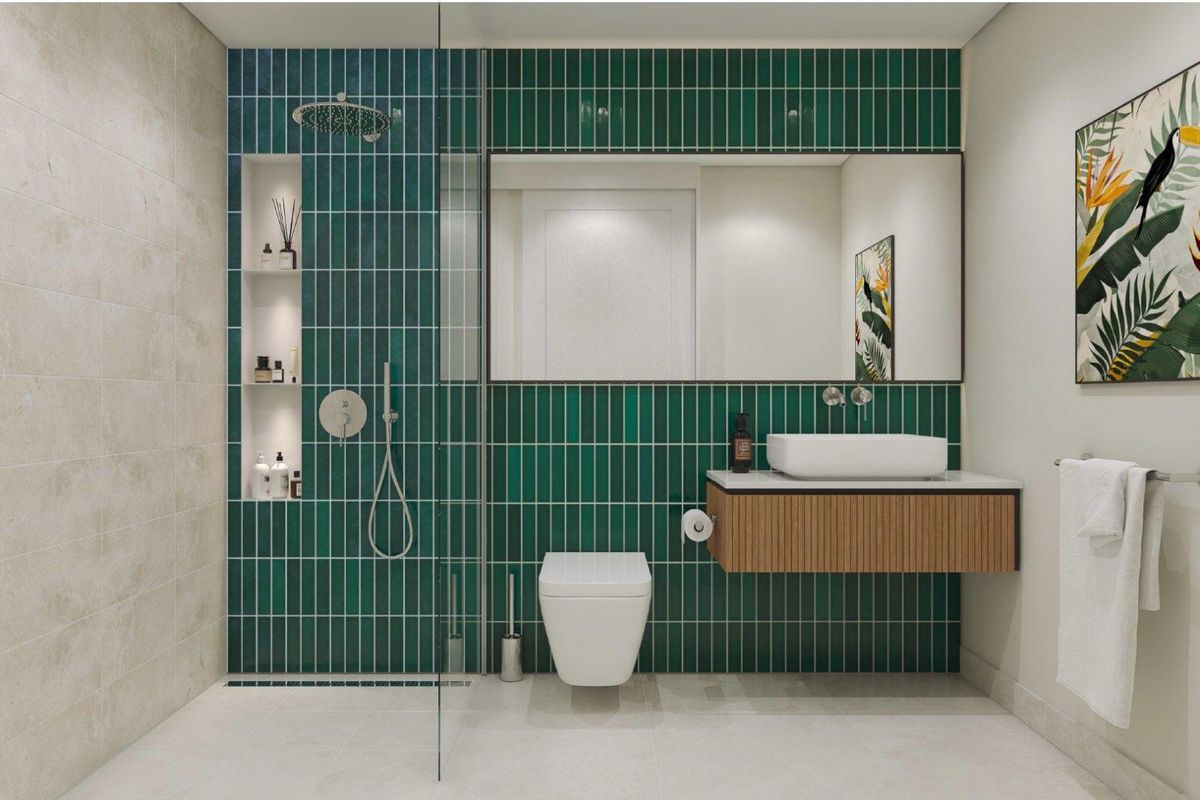Modern bathroom featuring a walk-in shower with green vertical tiling, a wall-mounted vanity with a vessel sink, and a wall-hung toilet.
