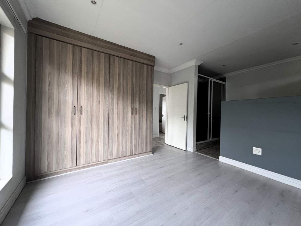 Overview to sun splashed main bedroom