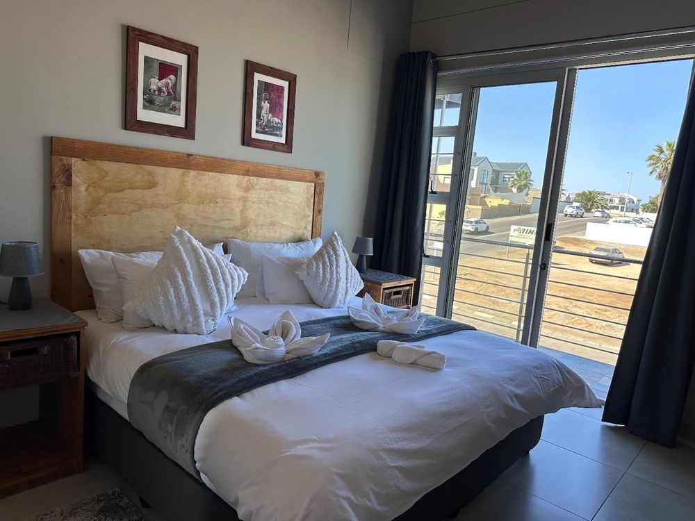 Main Flat, 2 ensuite bedrooms, open plan kitchen with lounge and inside barbecue and balcony.