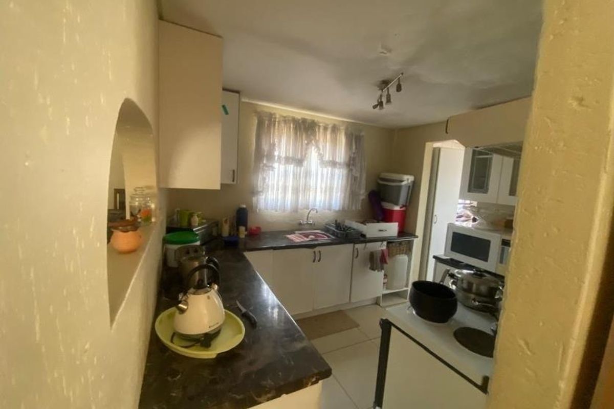 Complete This 2-Bed Home & Profit from 6-Room Rentals Now! - Photo 3