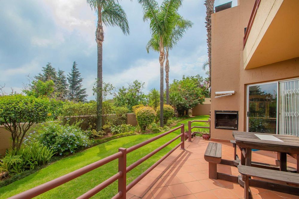 Patio off dining room and main bedroom with lush communal garden 