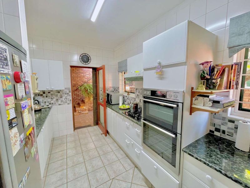 **Charming 3-Bedroom Home with Separate Flatlet, Backup Power, and Low Levies in Faeriedale Security Village, Faerie Glen** - Photo 2