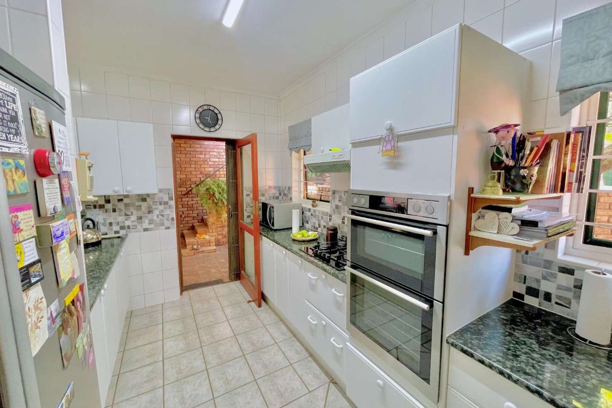 **Charming 3-Bedroom Home with Separate Flatlet, Backup Power, and Low Levies in Faeriedale Security Village, Faerie Glen** - Photo 2