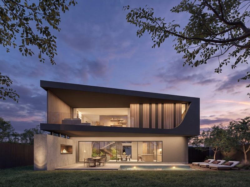 A stunning modern two-story residence featuring a rear patio, swimming pool, outdoor fireplace, and expansive glass sliding doors at dusk.