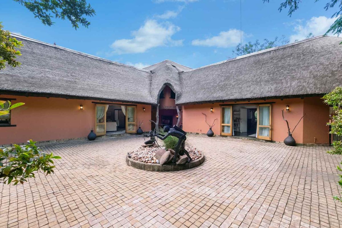 AN EXQUISITE, BUSH LODGE-THEMED, FAMILY SANCTUARY OFFERING TIMELESS ELEGANCE AND UNMATCHED TRANQUILITY IN A SERENE INDIGENOUS GARDEN SETTING - Photo 5