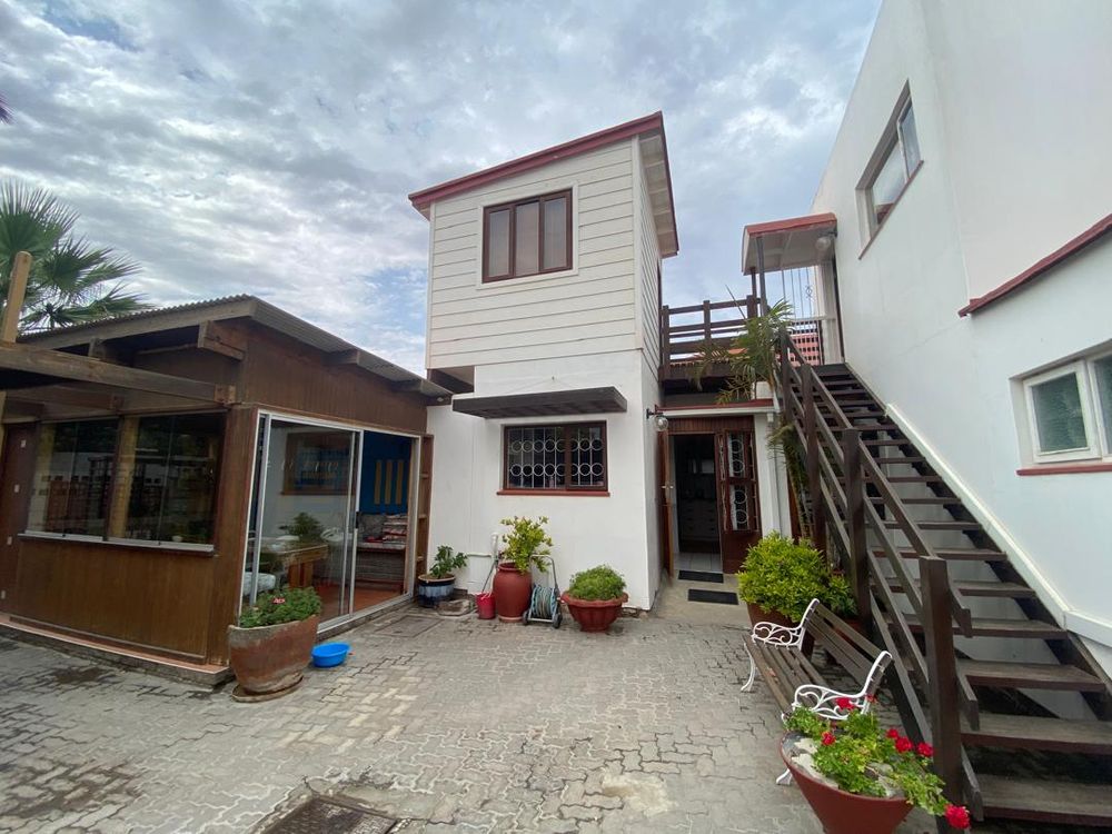 Inner courtyard. Kitchen entrance and stairs leading to the third bedroom and one of the flats