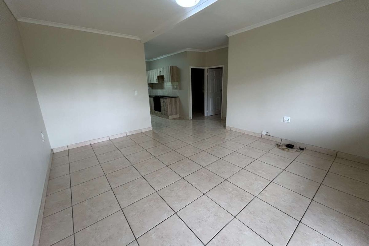 Charming Two-Bedroom Garden Apartment in a Secure Complex - Photo 3