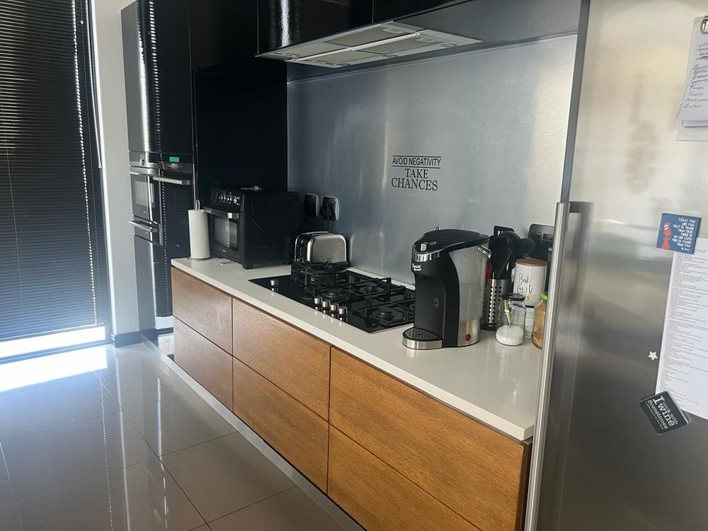 Kitchen counter with stove and oven on first floor