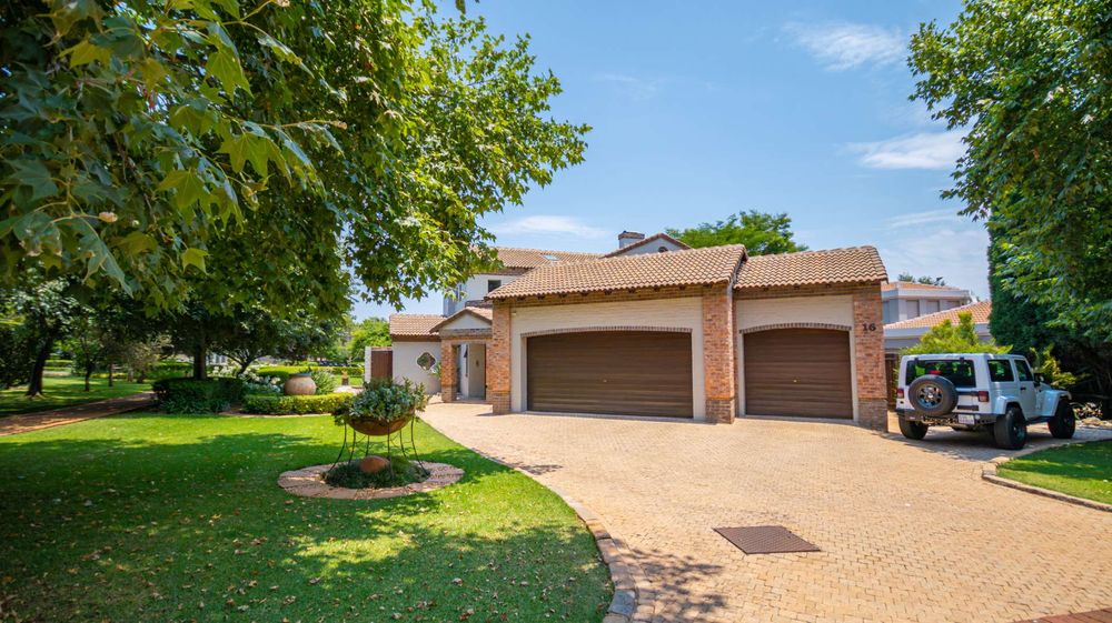 Shady parking area next to garages
