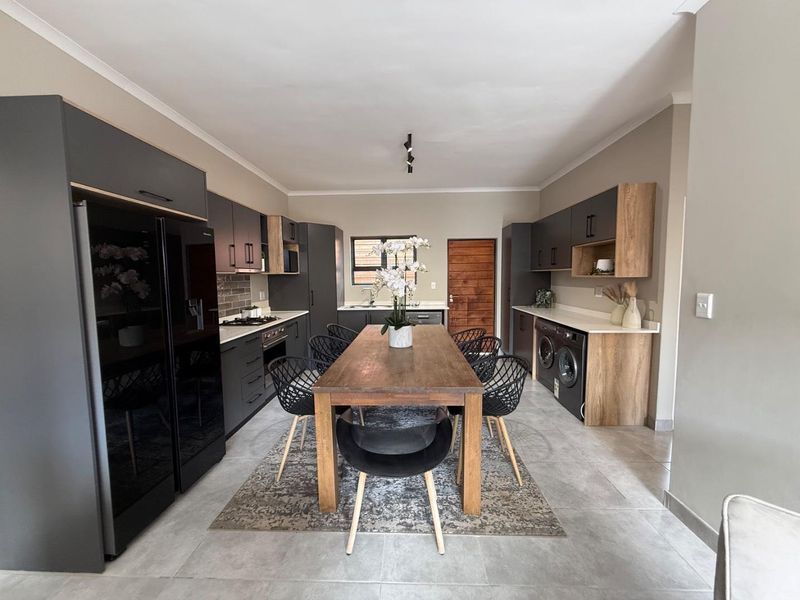 Sophisticated 3-Bedroom Simplex with Double Garage and Private Garden Sanctuary - Photo 5