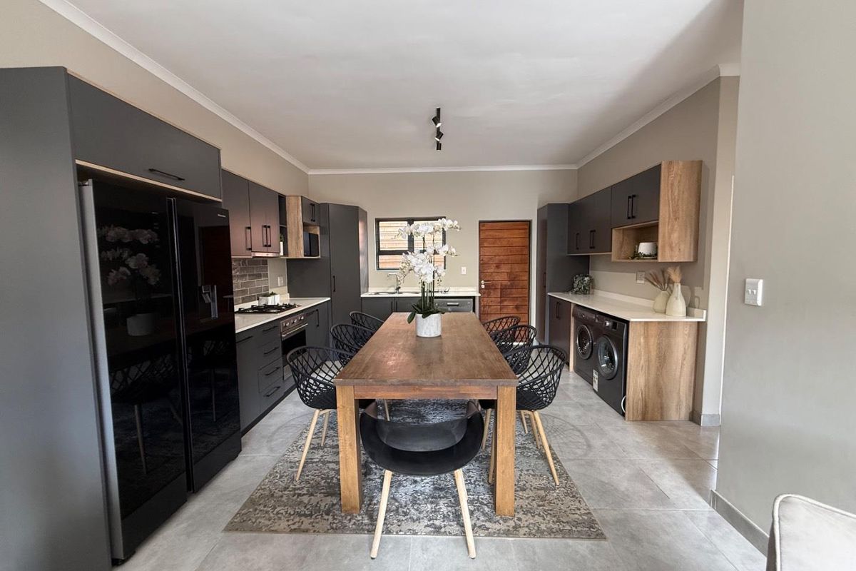 Sophisticated 3-Bedroom Simplex with Double Garage and Private Garden Sanctuary - Photo 5