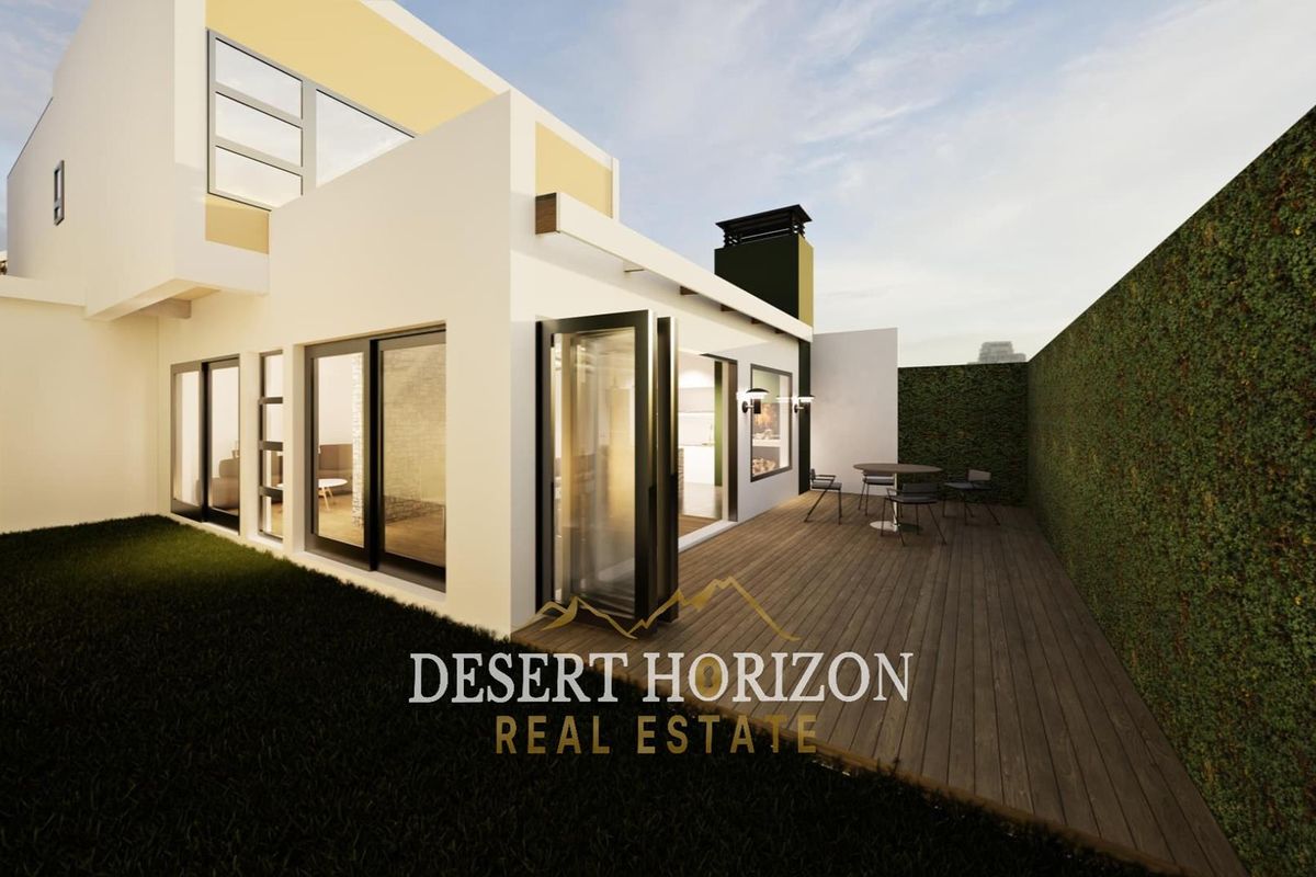 A modern exterior view of the property featuring a wooden deck, bi-fold glass doors, and a landscaped garden area.
