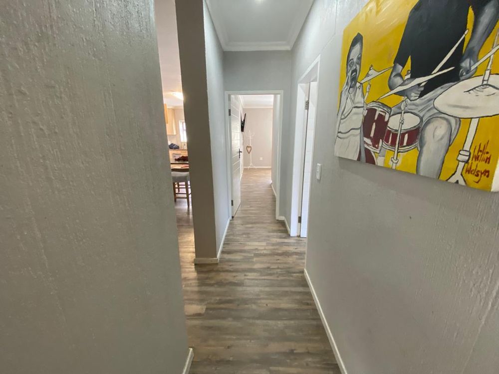 Ground floor hallway leading to three bedrooms