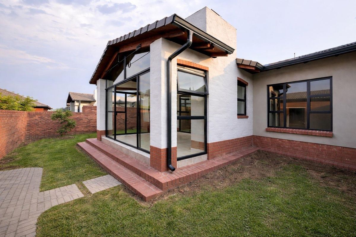 Unique iQ Marula 3-Bedroom Single-Level Townhouse with stacking doors by the patio and Double Garage - Photo 2