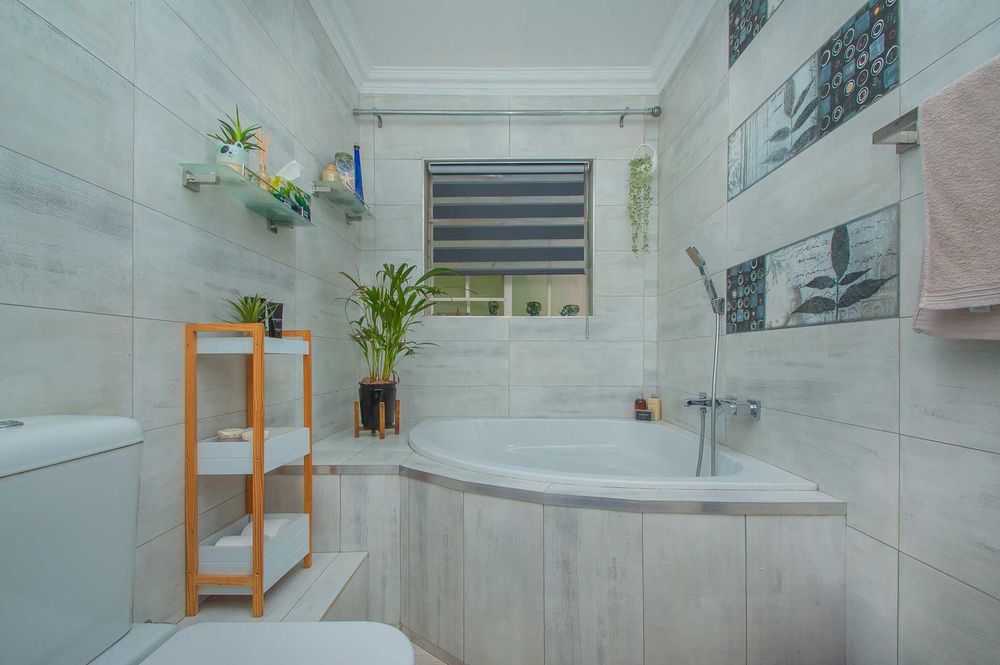 Family bathroom with feature corner bath