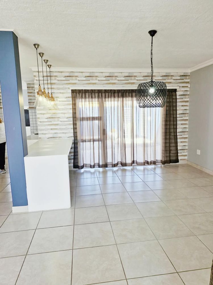 Open plan kitchen with lounge and dining room