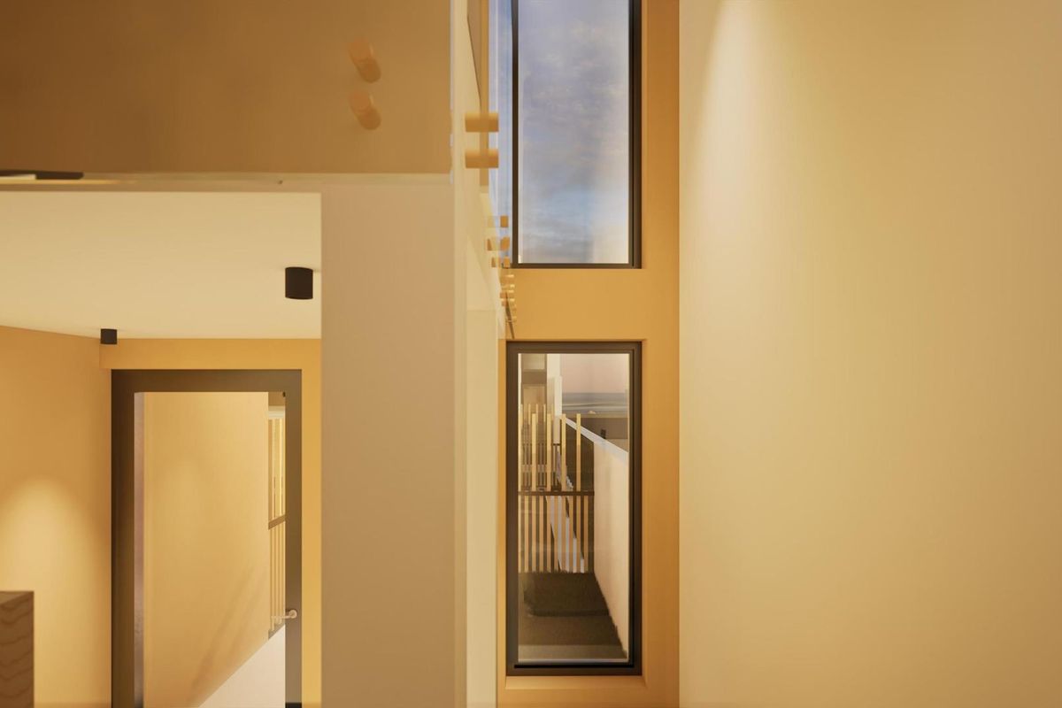 A modern interior view featuring high ceilings, tall vertical windows, and clean architectural lines, showcasing a bright and contemporary living space.