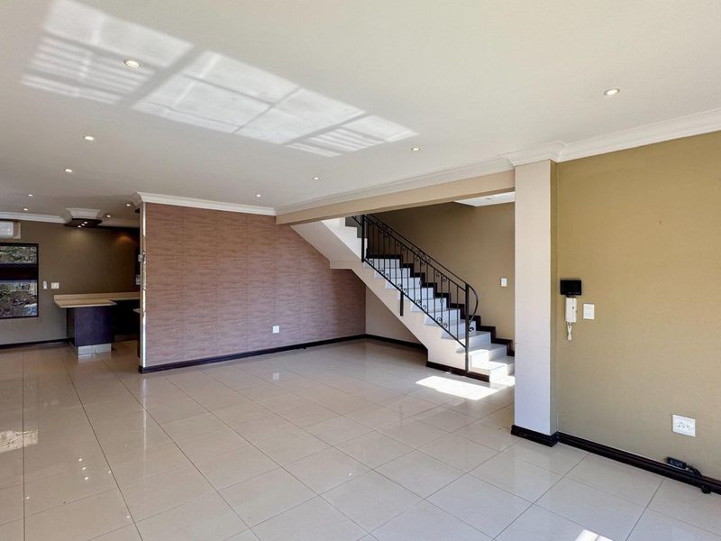 This spacious freestanding townhouse offers comfortable family living with excellent security and stylish finishes throughout. - Photo 6