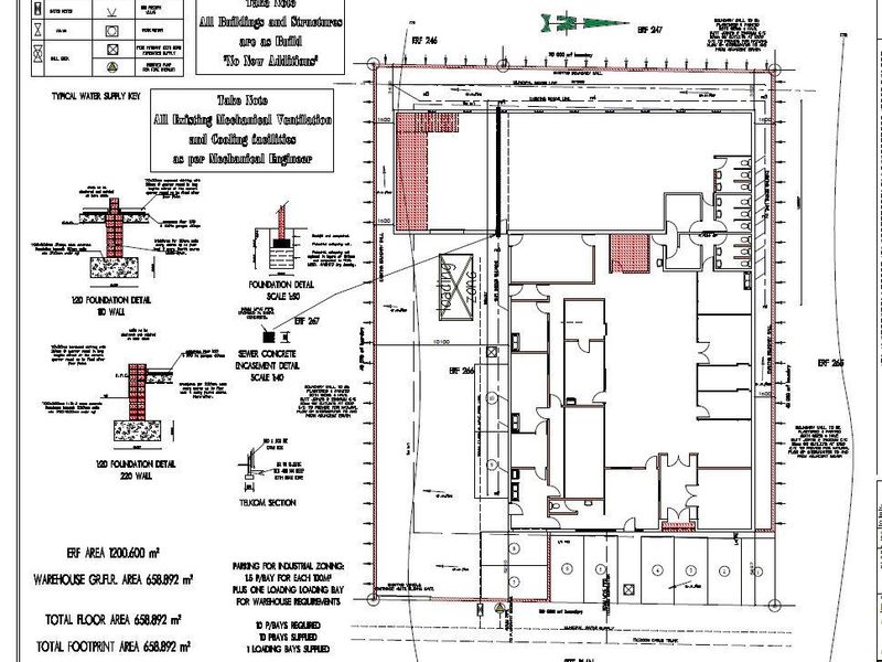 Architectural site plan and foundation details for an industrial property, including warehouse footprint, parking allocation, and loading zone specifications.