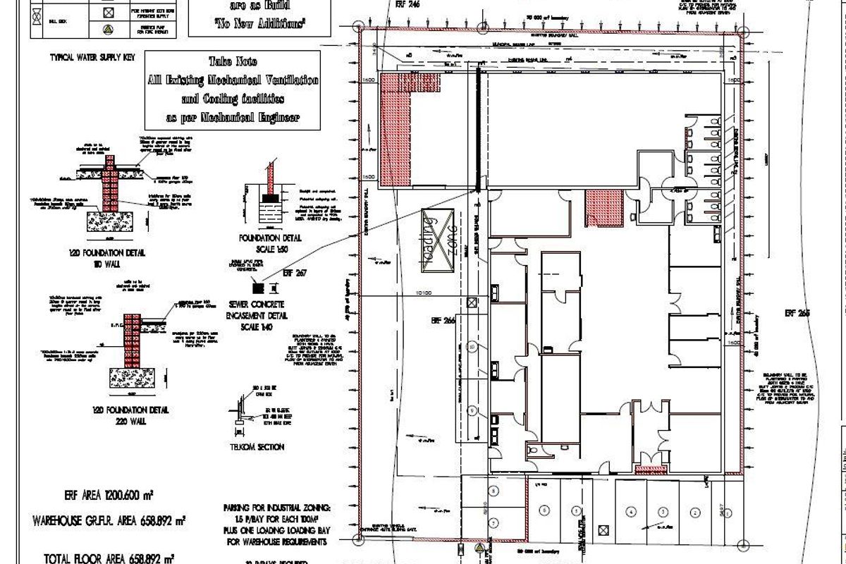 Architectural site plan and foundation details for an industrial property, including warehouse footprint, parking allocation, and loading zone specifications.