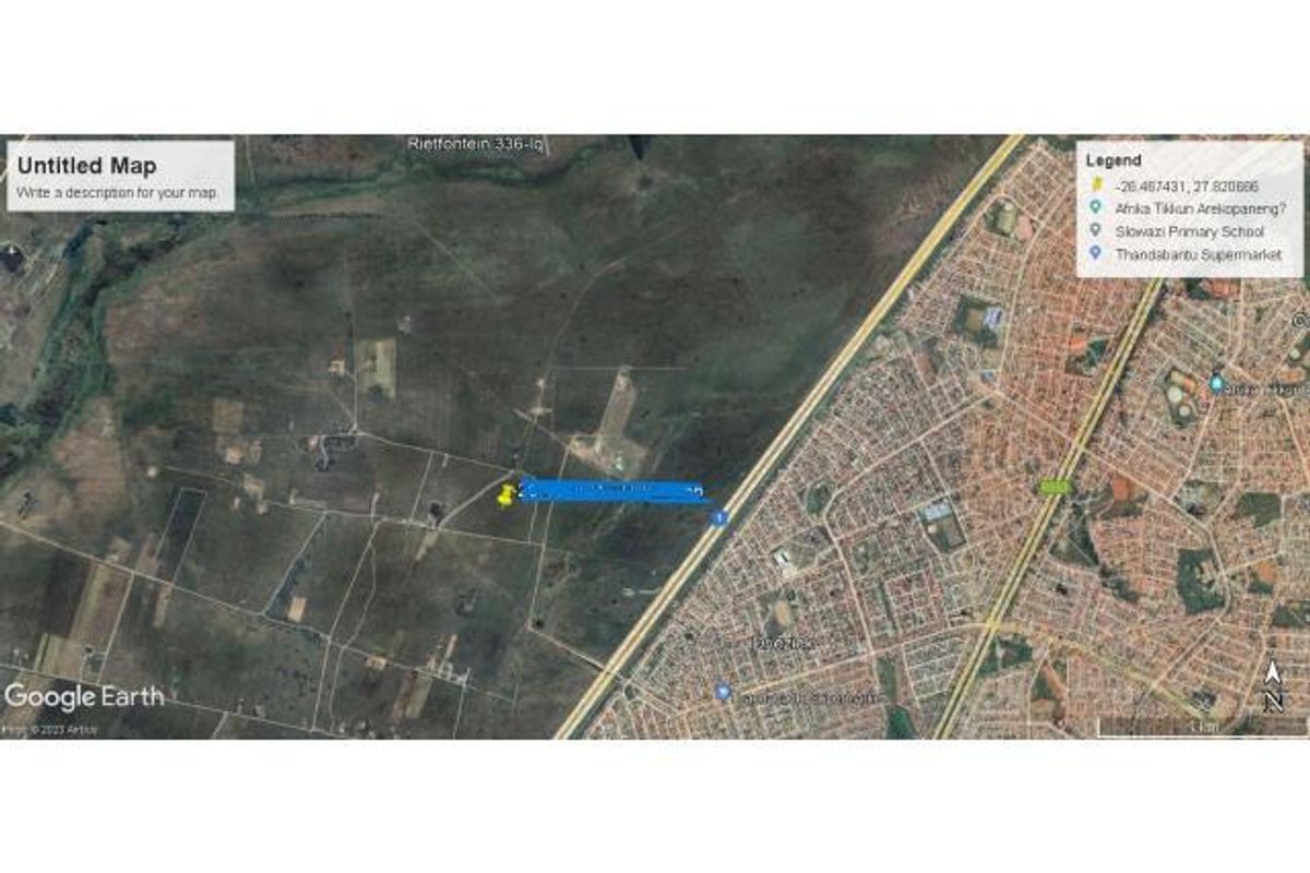 An aerial satellite view showing the location of the agricultural land parcel relative to the surrounding residential area and local infrastructure.